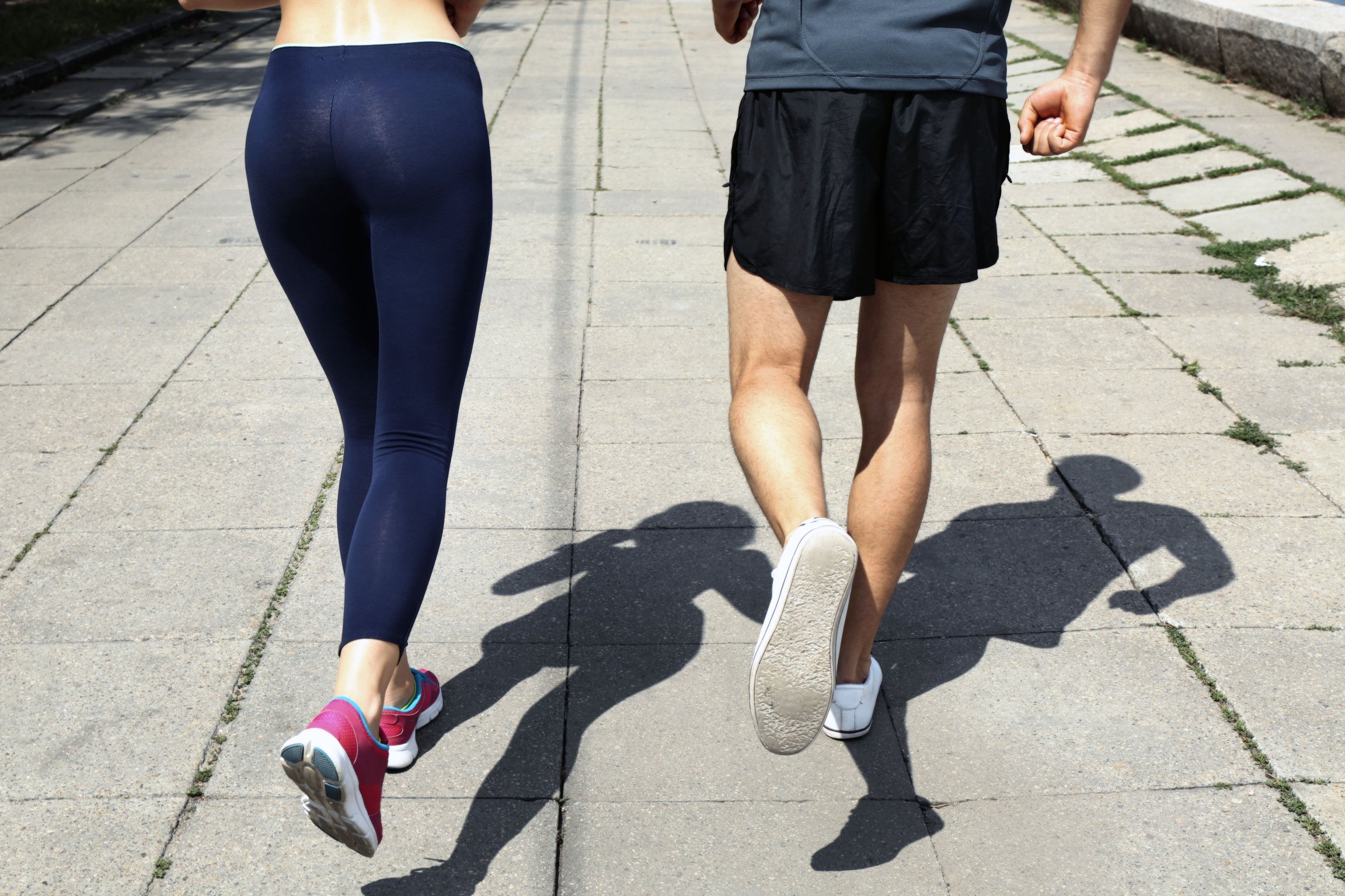 Man and Woman Jogging Outdoors